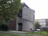 [The exterior stairwells on the Osward Place estate were distinctive but drab as built (25/09/2002).]