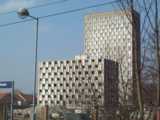 [The last few floors of Camelot House remained next to Pendragon House in March 2003.]