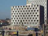 [The last few floors of Camelot House remained next to Pendragon House in March 2003.]