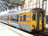 [317 7xx at Liverpool&nbsp;St in new 'one Stansted Express' livery (28/06/2004).]
