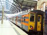[317 7xx at Liverpool&nbsp;St in new 'one Stansted Express' livery (28/06/2004).]
