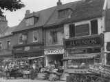 [East side of The Green in 1949 featuring Boots and Linwoods.]